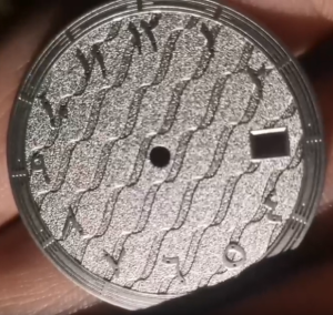 Grainy finish dial